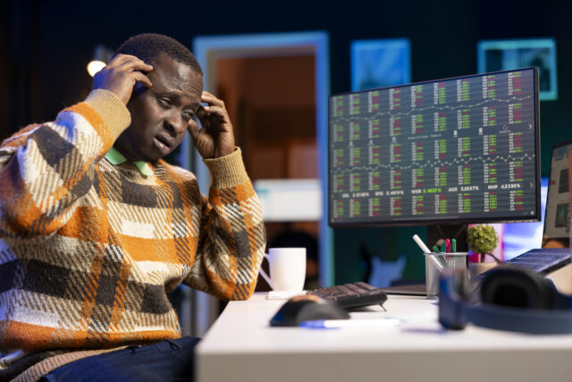 Frustrated sick accountant working on revenue balance at home office